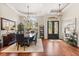 Formal dining room with hardwood flooring, a chandelier, and stylish decor near the entryway at 240 Promenade Cir, Lake Mary, FL 32746