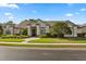 Charming stucco home with well-maintained landscaping and tile roof at 240 Promenade Cir, Lake Mary, FL 32746