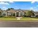 Charming stucco home with well-maintained landscaping and tile roof at 240 Promenade Cir, Lake Mary, FL 32746