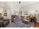 Spacious living room with comfortable sectional sofa and view to kitchen at 240 Promenade Cir, Lake Mary, FL 32746