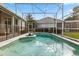 A pristine in-ground swimming pool with screened enclosure and safety fence is perfect for outdoor enjoyment at 240 Promenade Cir, Lake Mary, FL 32746