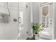 Elegant walk-in shower with a glass enclosure, plus a bright white door to the outdoor patio at 240 Promenade Cir, Lake Mary, FL 32746