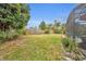 Lush backyard with a well-maintained lawn and mature trees, creating a serene outdoor space at 2510 Kiowa Trl, Fern Park, FL 32730