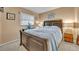 Cozy bedroom featuring a large bed, side tables and natural light at 2510 Kiowa Trl, Fern Park, FL 32730