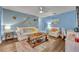 Comfortable living room with wood-look floors, and tasteful nautical decor at 2510 Kiowa Trl, Fern Park, FL 32730
