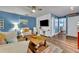 Inviting living room with wood-look floors, and comfortable seating at 2510 Kiowa Trl, Fern Park, FL 32730