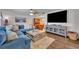 Comfortable living room with a large blue sofa, hardwood floors, and a neutral rug at 2510 Kiowa Trl, Fern Park, FL 32730