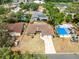 Aerial view of the home showcasing its location, surrounding greenery, and neighborhood at 2618 Grassmere Ln, Orlando, FL 32808