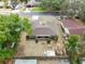 Charming home with a screened-in porch and mature trees shading the backyard at 2618 Grassmere Ln, Orlando, FL 32808