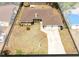 Sprawling single-story home with a two-car garage and a large, sunny front yard at 2618 Grassmere Ln, Orlando, FL 32808