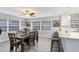 Dining area with modern decor, wood flooring, and abundant natural light at 2618 Grassmere Ln, Orlando, FL 32808
