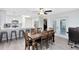 Bright dining and kitchen area with natural light, stainless steel appliances, and granite counters at 2618 Grassmere Ln, Orlando, FL 32808