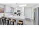 Bright kitchen with white cabinets, stainless appliances, granite countertops, and breakfast bar at 2618 Grassmere Ln, Orlando, FL 32808