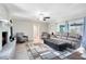 Spacious living room with brick fireplace, wood floors, and stylish furniture at 2618 Grassmere Ln, Orlando, FL 32808