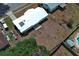 Aerial view of the white roof and brown yard of the one-story home at 3212 Acoma Dr, Orlando, FL 32829