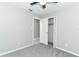 Bedroom featuring a ceiling fan, carpeting, closet, and bright natural light at 3212 Acoma Dr, Orlando, FL 32829