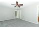 Bedroom with new gray carpet and a ceiling fan at 3212 Acoma Dr, Orlando, FL 32829