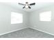 Bedroom featuring new gray carpet, a ceiling fan, and natural light at 3212 Acoma Dr, Orlando, FL 32829