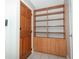 Foyer with wood-look bookcase and tile flooring, adjacent to the front door at 3212 Acoma Dr, Orlando, FL 32829