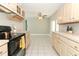 Bright kitchen with cream-colored cabinets and a breakfast nook at 3212 Acoma Dr, Orlando, FL 32829
