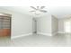 Bright living room features tile floors, neutral paint, and a modern ceiling fan at 3212 Acoma Dr, Orlando, FL 32829