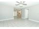Bright living room features tile floors, neutral paint, and a modern ceiling fan at 3212 Acoma Dr, Orlando, FL 32829
