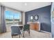 Bright home office featuring a large window with neutral colors and modern desk setup at 3821 Royal Azalea Way, Sanford, FL 32773