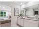 Bright bathroom with granite vanity, modern decor, and entry into a bedroom at 3833 Royal Azalea Way, Sanford, FL 32773
