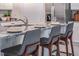 Kitchen island with granite countertop and bar seating at 3833 Royal Azalea Way, Sanford, FL 32773