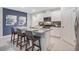Stylish kitchen with stainless appliances, breakfast bar and granite countertops at 3833 Royal Azalea Way, Sanford, FL 32773