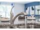 Modern kitchen faucet over granite countertop near dinnerware at 3833 Royal Azalea Way, Sanford, FL 32773