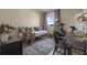 Well-lit bedroom with daybed, desk, Peloton, large window, and stylish decor for comfortable living at 4054 Silverstream Ter, Sanford, FL 32771