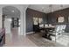 Elegant dining room features modern chandelier, dark walls, and doorway view to living room at 4054 Silverstream Ter, Sanford, FL 32771