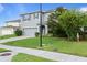 Traditional exterior view of two-story home with gray stucco and meticulous landscaping at 4054 Silverstream Ter, Sanford, FL 32771