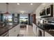 Modern kitchen featuring granite countertops, stainless steel appliances, and an open floor plan at 4054 Silverstream Ter, Sanford, FL 32771