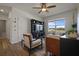 Cozy living room with dark entertainment center, comfortable seating, and a scenic window view at 4054 Silverstream Ter, Sanford, FL 32771