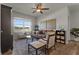 Inviting living room boasts ample seating, a ceiling fan, and serene water views from the window at 4054 Silverstream Ter, Sanford, FL 32771