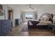 Bright primary bedroom with a decorative rug, three dressers, and a view to the outside at 4054 Silverstream Ter, Sanford, FL 32771