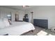Bright primary bedroom with a decorative rug, three dressers, and a view to the outside at 4054 Silverstream Ter, Sanford, FL 32771