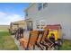 Outdoor patio area featuring a grill, lounge chairs, outdoor seating, and a playhouse at 4054 Silverstream Ter, Sanford, FL 32771
