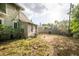 Spacious backyard with a partial fence, mature trees, and potential for outdoor enjoyment at 419 Palm Ave, Eustis, FL 32726