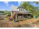 Charming two-story home with a metal roof and covered front porch at 419 Palm Ave, Eustis, FL 32726