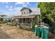 Charming two-story home with a metal roof and covered front porch at 419 Palm Ave, Eustis, FL 32726