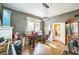Spacious living room featuring a foosball table, hard wood floors, and a quirky chandelier at 419 Palm Ave, Eustis, FL 32726