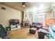 Inviting living room features a brick fireplace and gleaming hardwood floors at 419 Palm Ave, Eustis, FL 32726