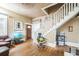 Open-concept living room showcasing hardwood floors and staircase at 419 Palm Ave, Eustis, FL 32726