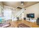 Open-concept living room showcasing hardwood floors and staircase at 419 Palm Ave, Eustis, FL 32726