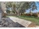Spacious backyard with a mature tree, grass and a wood fence at 4201 Chantelle Rd, Orlando, FL 32808