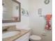 Cozy bathroom featuring a stone countertop, mirror and tasteful decor at 4201 Chantelle Rd, Orlando, FL 32808