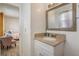 Bathroom vanity featuring neutral paint tones and natural light at 4201 Chantelle Rd, Orlando, FL 32808